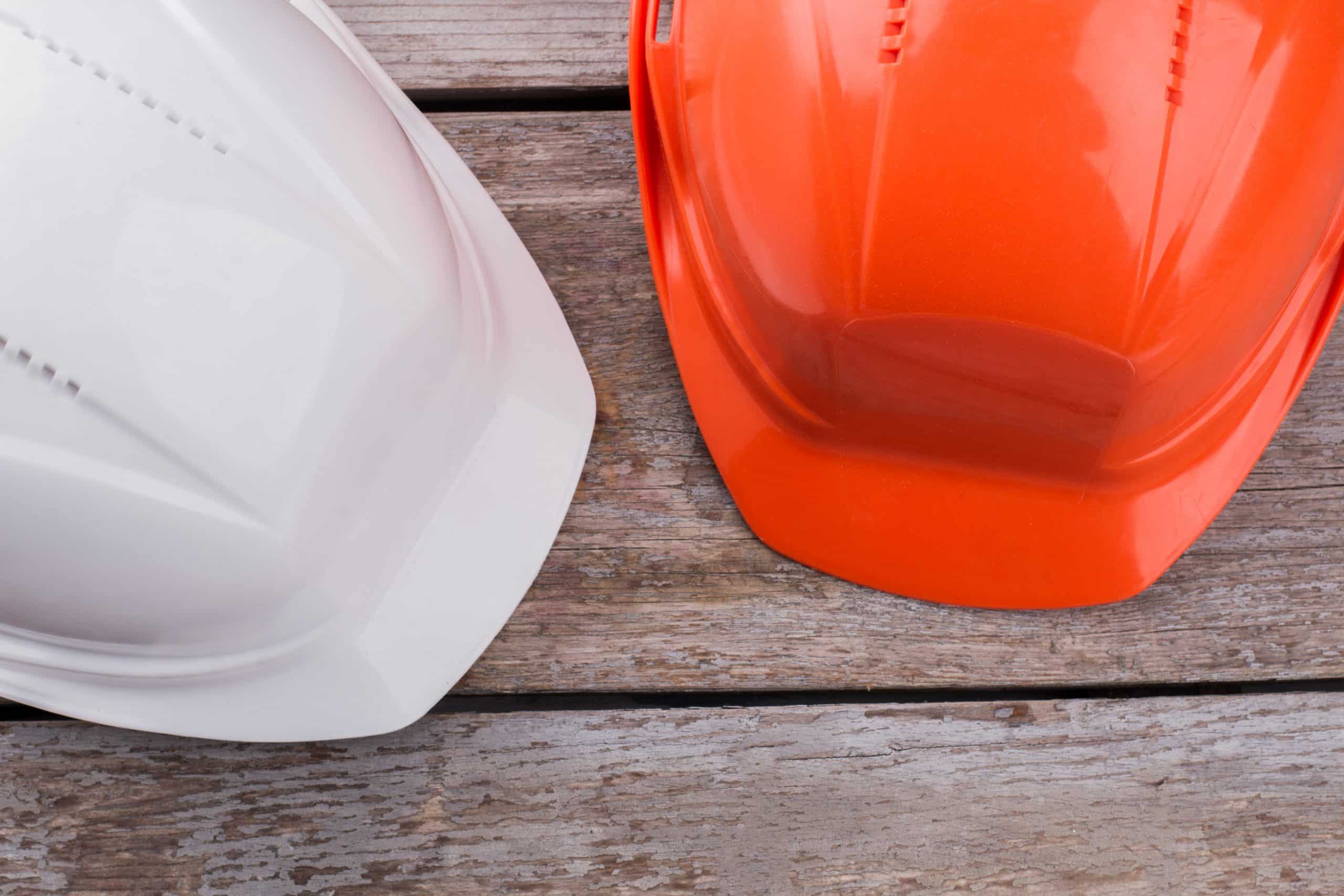 Two Construction Workers Safety Helmets
