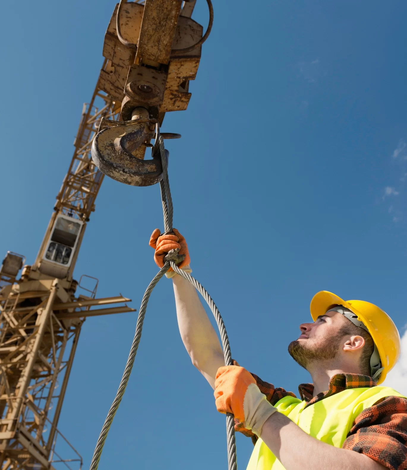 Slinger/ Signaller Preparing To Hoist A Load