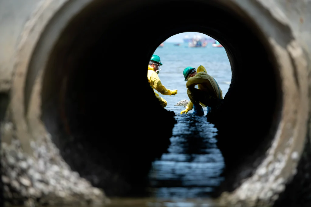 Two Workers Operating In A Confined Space